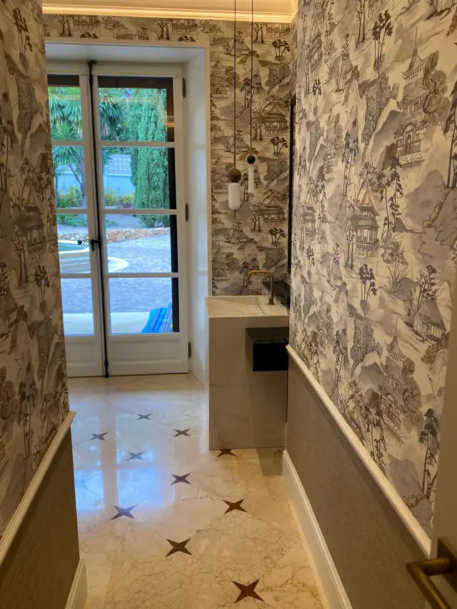 Living room with wallpapered walls