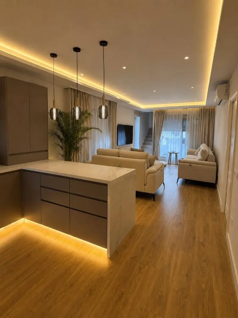 Salón y cocina abiertos tras reforma integral — iluminación LED